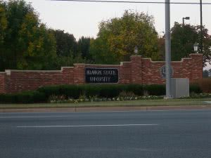 College sign at Delaware State University entrance taken from across the street.