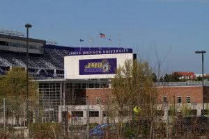 James Madison University stadium with a purple sign.