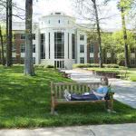 Student studying while sitting on a bench at Berry College.