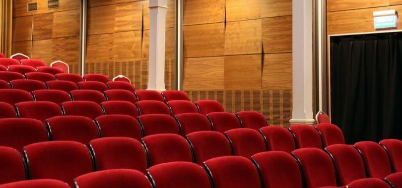 Rows of red theater seats.