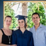 College graduate with her parents.