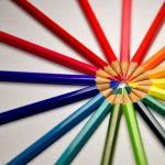 Colored pencils pointing to each other in a circular formation.