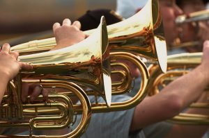 Close up of hands playing baritones.