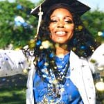 A graduating student throwing confetti.