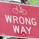 A red sign that says "wrong way."