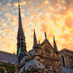 A chapel with a sunset in the background.