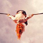 A student balancing on a tight rope.