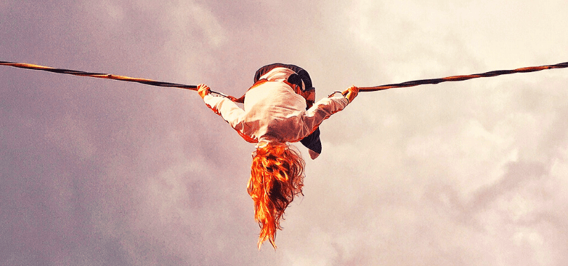 A student balancing on a tight rope.