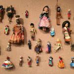 A bunch of hanging dolls in doll exhibit main library.