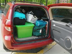 Red van loaded with packed boxes for freshman move-in day.