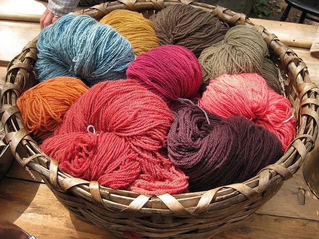 Colorful yarns in a basket.
