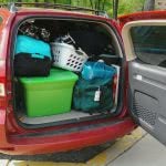 Red van loaded with packed boxes for freshman move-in day.