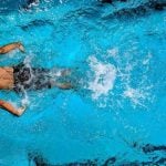 A person swimming in a pool.