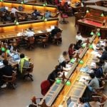 Students sitting in a college library.