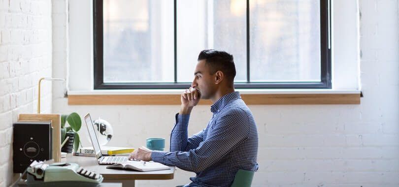 College academic advisor sitting at their desk.