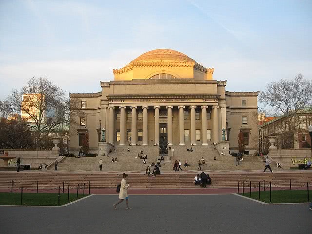 Columbia University Library with people on the foreground.