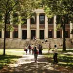 Students walking around Harvard Yard.