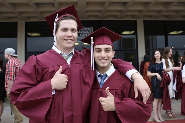Two graduating students thinking about grad school