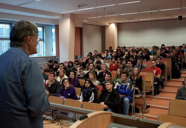 Students in lecture hall explore majors at a college