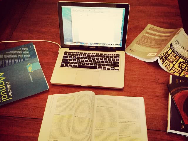 Textbooks and laptop - too many classes can lead to burnout!