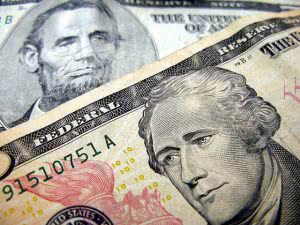 5 and 10 dollar bills - you can save more if you understand the importance of student loan interest rates