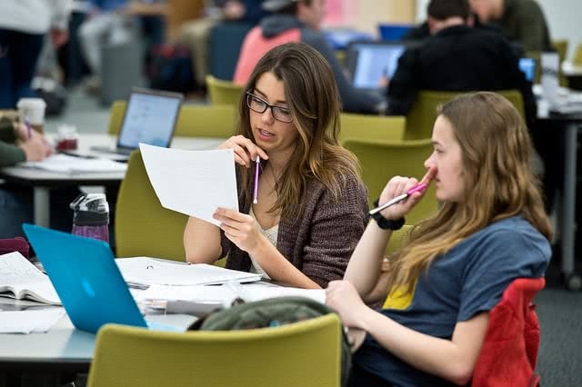 Two students study hard for their ACT or SAT exams