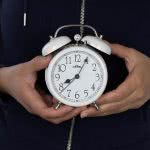 Girl holding alarm clock - make sure you don't miss the FAFSA deadline