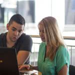 Students looking at a computer - considering College Ave student loans