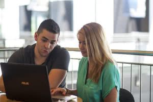 Students looking at a computer - considering College Ave student loans