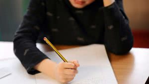 Student thinking and studying for the SAT, trying to earn their highest SAT score