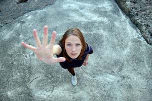 Student reaching up - it's important to have reach, match, and safety schools on your college list