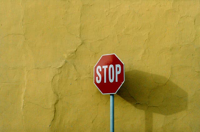 Stop sign - you can prevent student loan default by stopping it before it starts