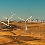 A wind farm spanning across multiple hills.