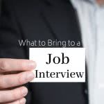 Man in suit with card that says: what to bring to a job interview