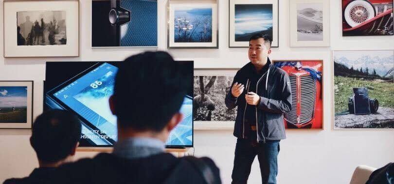 Students listening to a college professor lecture