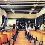 College counselors meeting in a lecture room.