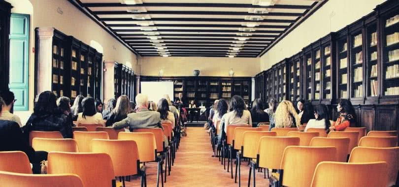 College counselors meeting in a lecture room.