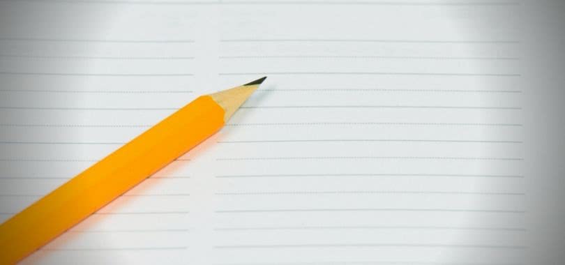 Yellow pencil on a blank lined test page.