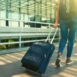 College student with suitcase at an airport