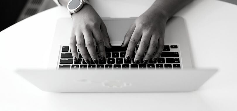 Student submitting application on a laptop.