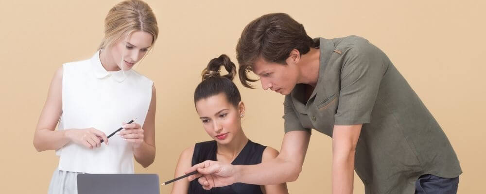 Two workers with an intern.