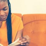 Student reading a book during the quarantine.