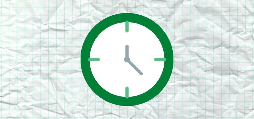 A clock icon on graph paper.