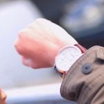 College student looking at her watch