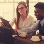 Students discussing career advice at a coffee shop.