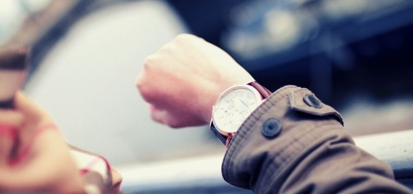 student waitlisted by a college looking at her watch