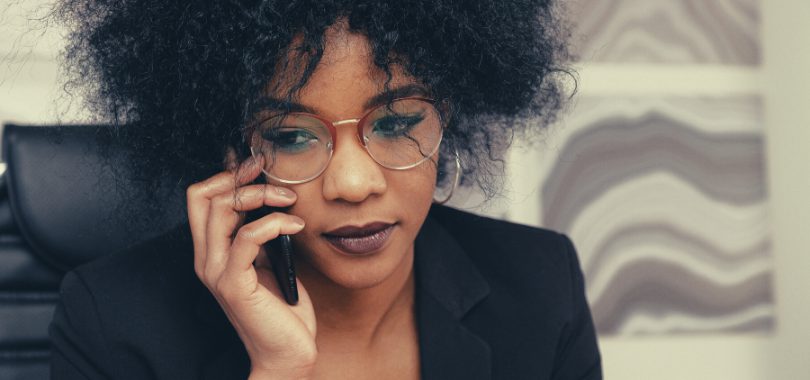 College student on phone with her student loan lender