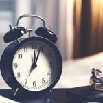 College student's alarm clock sitting on a desk.