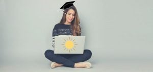 A high school student taking a college prep course on her laptop.