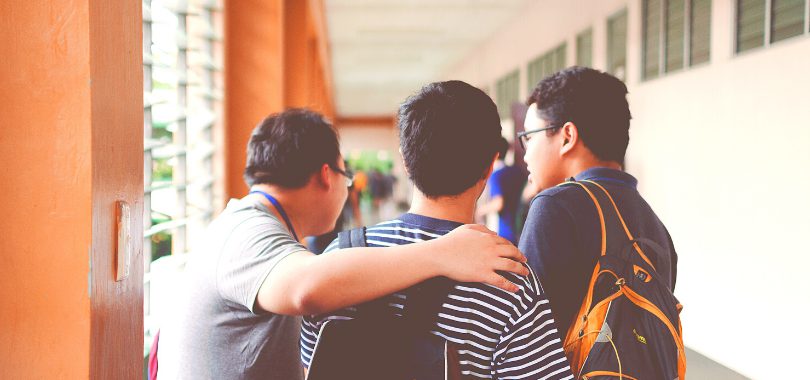 Three high school friends discuss college acceptance odds.